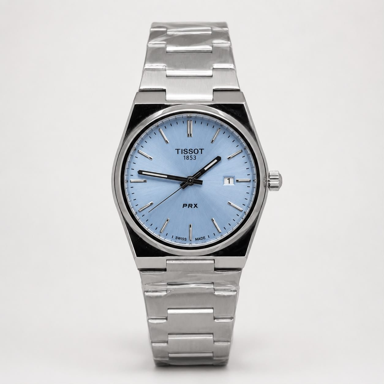 Tissot PRX 35mm watch with light blue dial and silver stainless steel bracelet.