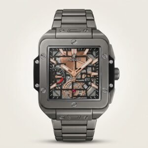 Square grey titanium-style skeleton watch with rose gold hands, visible movement, and rubber-inlaid metal bracelet.