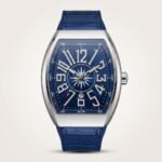 Stainless steel Tonneau-shaped watch with blue dial, nautical compass rose, large Arabic numerals, and blue leather strap.