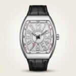 Stainless steel Tonneau watch with vertically brushed silver dial, black hands, small seconds sub-dial, and black leather strap.