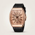 Polished rose gold-tone Tonneau watch with sunburst dial, compass rose, Arabic numerals, and black leather strap.
