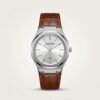 Bestwin men's quartz watch with silver dial, silver markers, and brown leather strap.