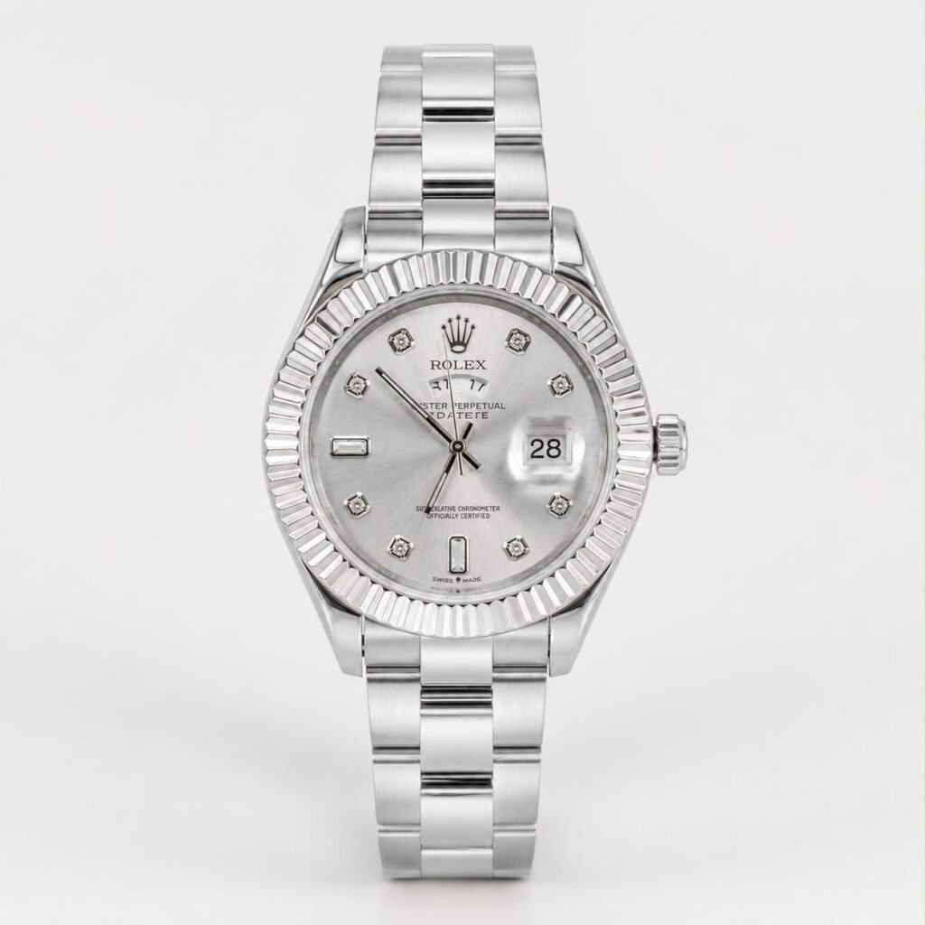 Silver-tone stainless steel watch with fluted bezel, sunburst dial, diamond hour markers, and date window at 3 o'clock.