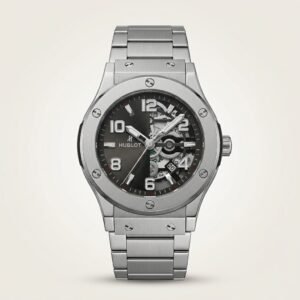 Silver-tone sport watch with black and grey dial, exposed skeleton gears, large Arabic numerals, and stainless steel bracelet.