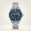 Silver-tone diver style quartz watch with blue textured dial, blue rotating bezel, luminous markers, and stainless steel bracelet.
