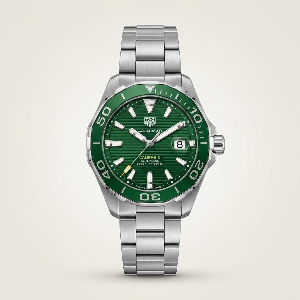 Silver-tone diver style quartz watch with green textured dial, luminous markers, green rotating bezel, and stainless steel bracelet