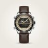 Tubular Hybrid Dual Time watch with black and gold dial, silver case, and brown leather strap.
