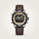 Tubular Hybrid Dual Time watch with black and gold dial, silver case, and brown leather strap.