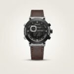 Tubular dual-time digital watch with black dial, 4-button case, and brown leather strap