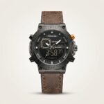 Tubular dual-time digital watch with black case, gold accents, and brown leather strap.