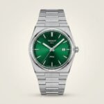 Silver-tone retro style watch with deep green sunburst dial, silver indices, and integrated steel bracelet.