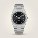 Silver-tone retro style watch with deep black sunburst dial, silver indices, and integrated steel bracelet.