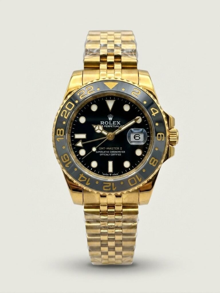 Gold-tone GMT style watch with black dial, black and grey bezel, and gold jubilee bracelet.