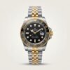Two-tone silver and gold GMT style watch with black dial, black and grey bezel, and two-tone jubilee bracelet
