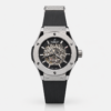 Premium silver-tone skeleton watch with black rubber strap, exposed gears, and six-screw bezel.