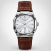 Square cushion dress watch with silver dial, stick indices, and black leather strap.
