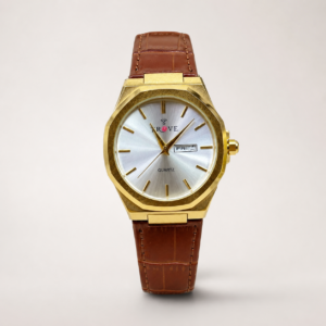Trove watch with gold case, silver dial, day-date window, and brown leather strap.