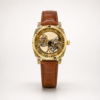 ROVITE automatic skeleton watch with carved gold case, Roman numerals, and brown leather strap.