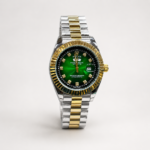 Two-tone silver and gold luxury style watch with green sunburst dial, crystal markers, gold fluted bezel, and jubilee bracelet.