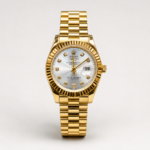 Full gold luxury style watch with silver sunburst dial, crystal markers, gold fluted bezel, day window, and presidential bracelet.
