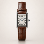 Silver rectangular dress watch with white dial, black Roman numerals, blued-steel hands, and brown leather strap.