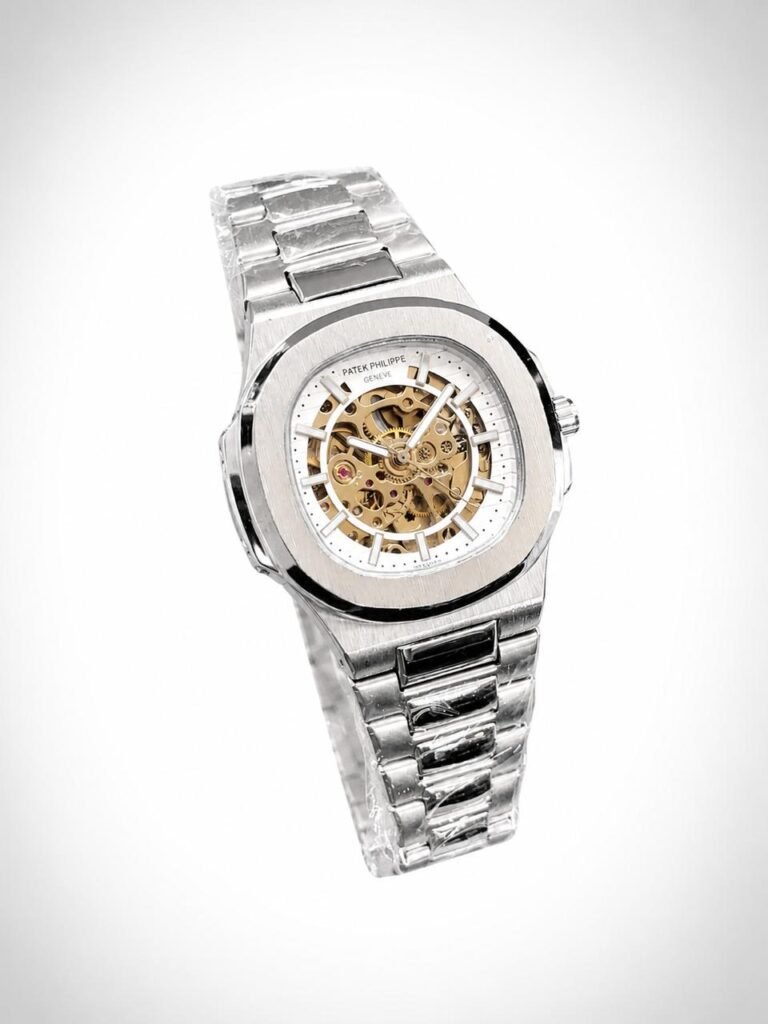 Silver skeleton watch with gold movement, white outer ring, and two-tone integrated bracelet.