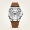 Silver dial Tubular quartz watch with silver baton indices, date window at 3 o'clock, and brown leather strap.