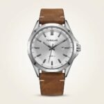 Silver dial Tubular quartz watch with silver baton indices, date window at 3 o'clock, and brown leather strap.