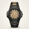 Matte black skeleton watch with exposed gold gears, gold indices, and black and gold integrated bracelet.