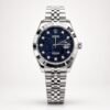 Silver luxury style watch with blue mosaic textured dial, crystal markers, fluted bezel, and jubilee bracelet.
