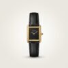 Gold rectangular dress watch with deep black dial, gold hands, and black leather strap.