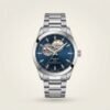 Silver Gentleman style watch with blue sunburst dial, open heart cutout, and stainless steel bracelet.