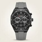 CURREN 8489 chronograph watch with black textured dial, silver markers, and grey silicone strap.