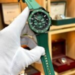 CURREN 8489 chronograph watch with green dial, luminous markers, and green silicone strap.