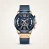CURREN 8329 chronograph watch with blue dial, rose gold case, and blue leather strap.