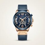 CURREN 8329 chronograph watch with blue dial, rose gold case, and blue leather strap.