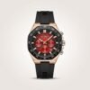 CURREN 8489 chronograph watch with a red dial, black case, and black silicone strap.