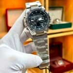 S-SPORT men's dual display watch with black dial, stainless steel case, and bracelet.