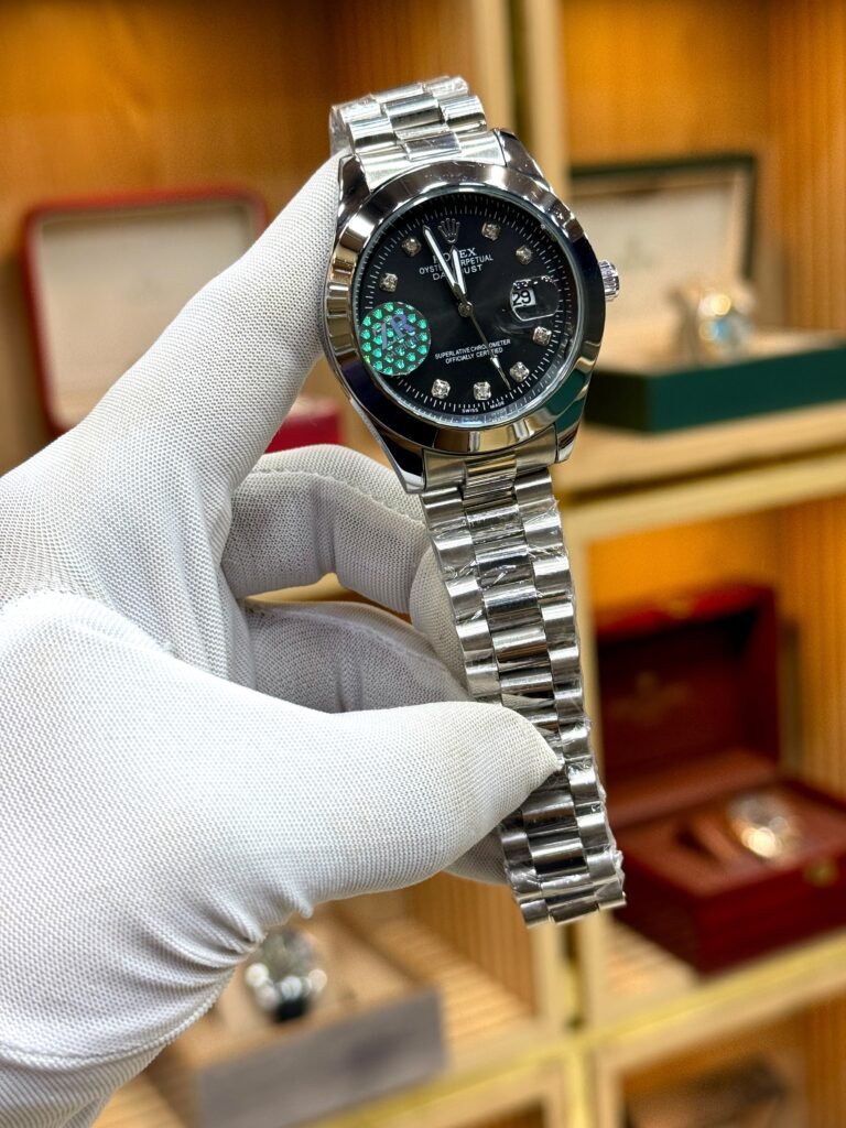 Silver luxury style watch with black dial, crystal hour markers, and silver jubilee bracelet.
