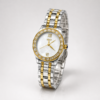 IEKE ladies luxury watch with mother of pearl dial, gold crystal bezel, and two-tone steel bracelet.