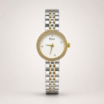 Two-tone ladies watch with pearl white dial, gold crystal bezel, and two-tone link bracelet.