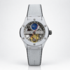 Automatic skeleton watch with tourbillon style cage, silver screw-down case, and white leather strap.