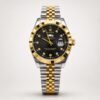 Two-tone silver and gold luxury style watch with black dial, crystal markers, gold fluted bezel, day window, and jubilee bracelet.